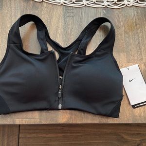 Nike dri fit, extra support, zip up bra. Never worn, tags still attached.